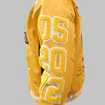 Close-up of embroidered letterman jacket featuring chenille initials and stitching