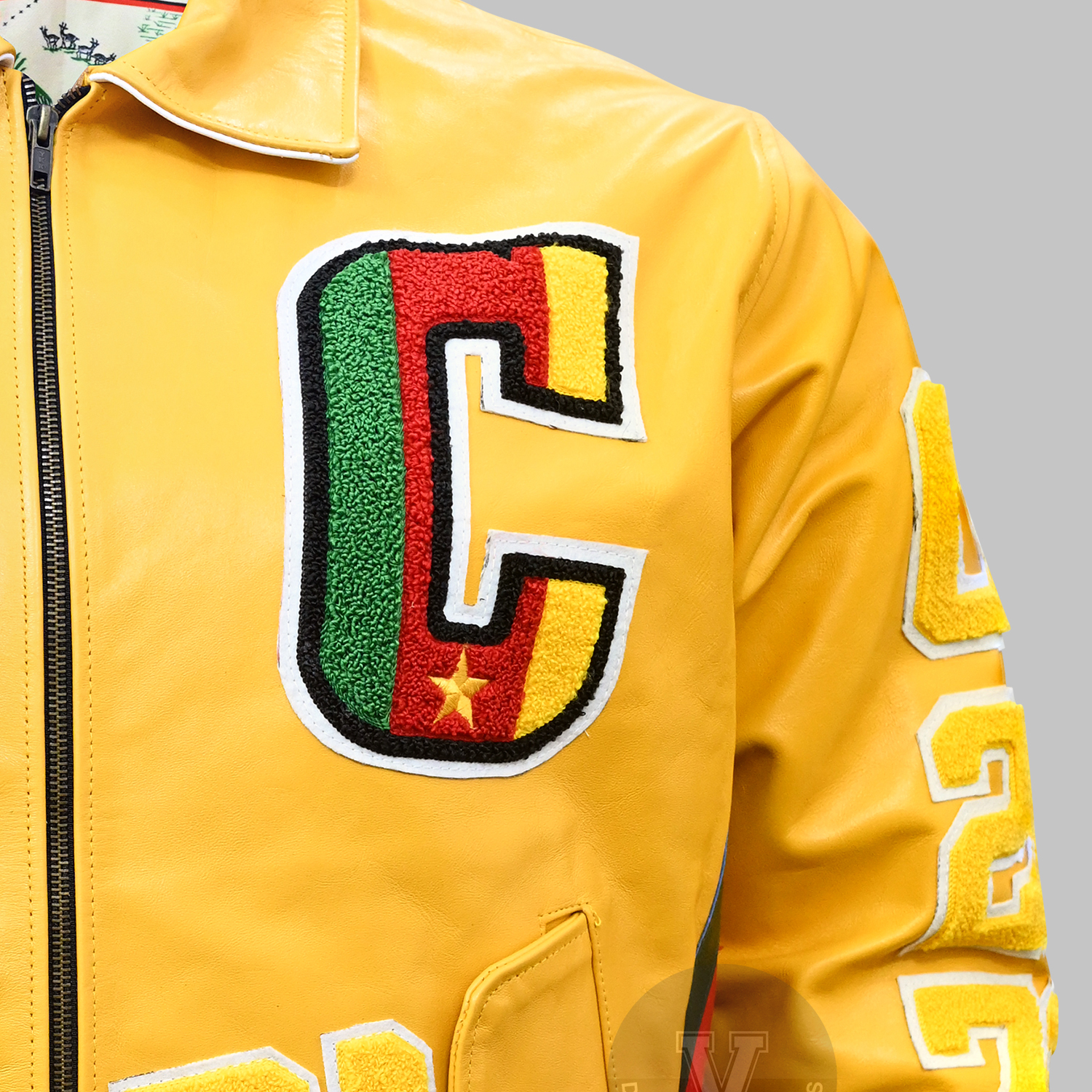 Close-up of embroidered letterman jacket featuring chenille initials Close-up of embroidered letterman jacket featuring chenille initials