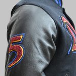 Close-up of embroidery and custom stitched patches on sleaves