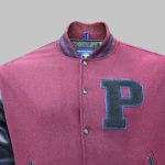 Close-up of embroidered letterman jacket featuring chenille initials